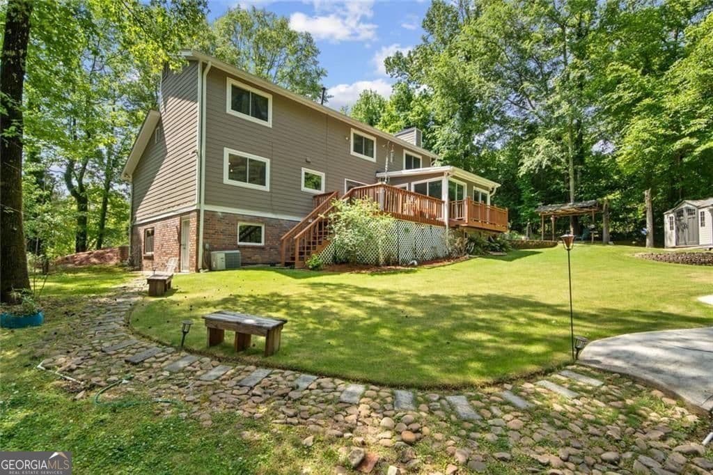 4 bedroom, 2.5 bathroom, 3,608 sq ft single family residence for sale at 5080 Nesbit Ferry Lane, Sandy Springs, GA 30350 — photo 3