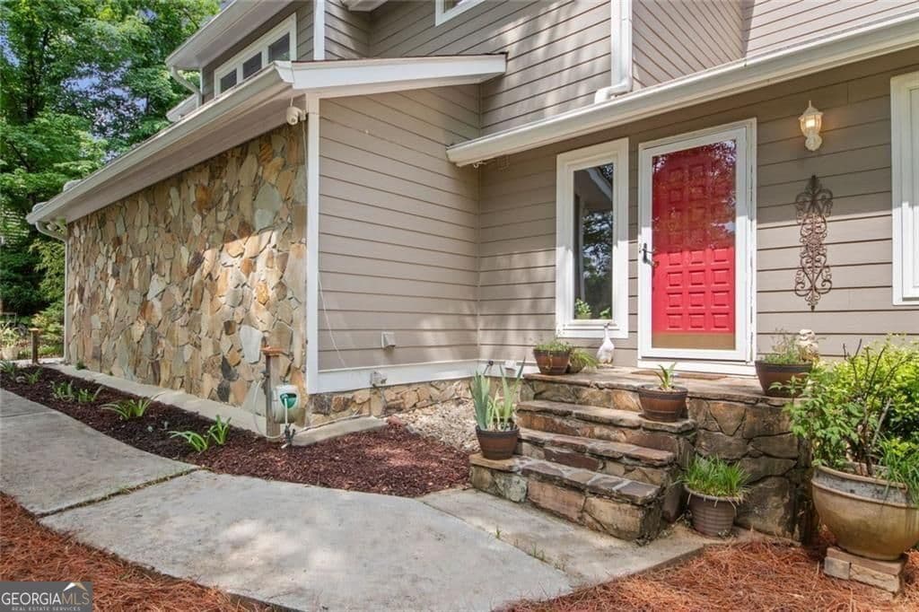 4 bedroom, 2.5 bathroom, 3,608 sq ft single family residence for sale at 5080 Nesbit Ferry Lane, Sandy Springs, GA 30350 — photo 4
