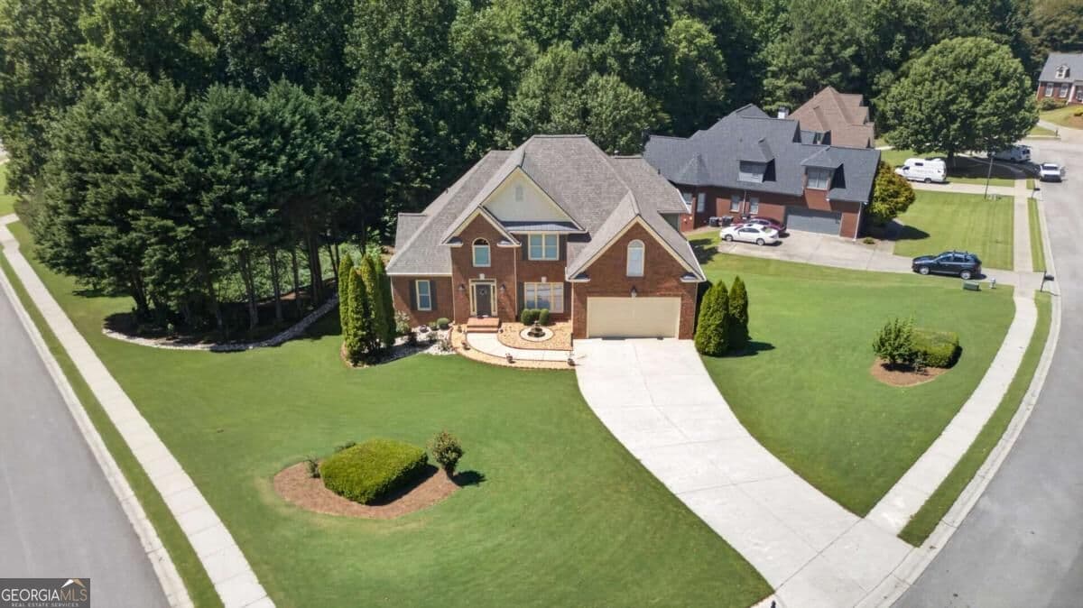 5 bedroom, 3 bathroom, 3,193 sq ft single family residence for sale at 5755 Shoals Drive, Buford, GA 30518 — photo 3