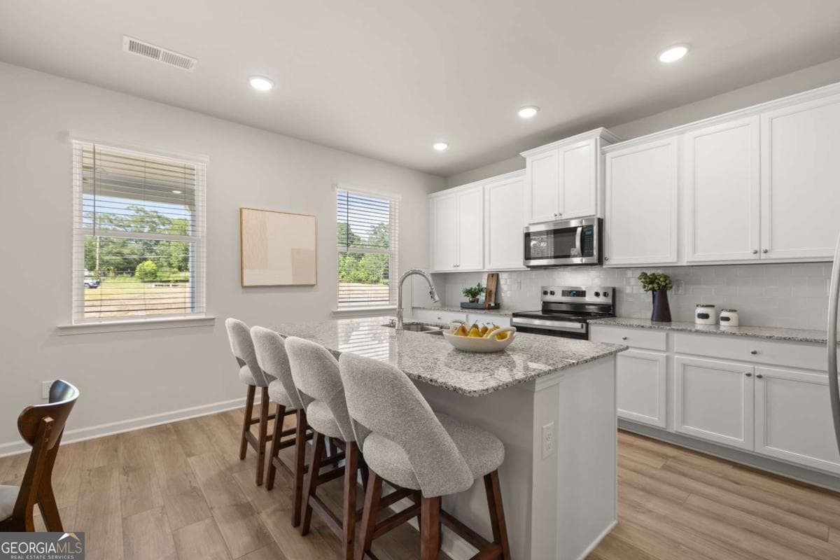 4 bedroom, 2.5 bathroom, 2,506 sq ft single family residence for sale at 1786 Kingsmere Run Drive LOT 11, Loganville, GA 30052 — photo 7