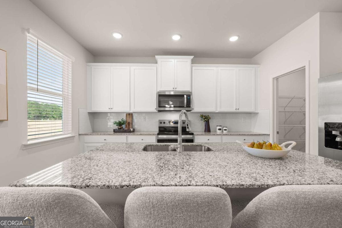4 bedroom, 2.5 bathroom, 2,506 sq ft single family residence for sale at 1786 Kingsmere Run Drive LOT 11, Loganville, GA 30052 — photo 8