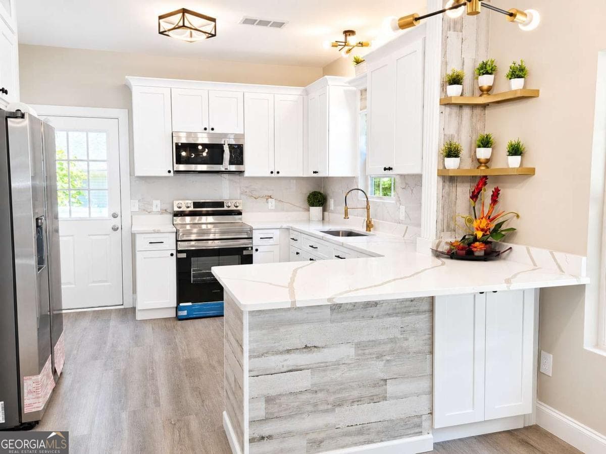 3 bedroom, 1.5 bathroom single family residence for sale at 9005 Lemans Trail, Gainesville, GA 30506 — photo 6