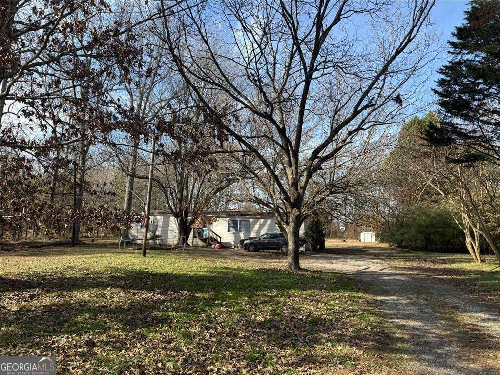 3 bedroom, 2 bathroom, 1,838 sq ft manufactured home,single family residence for sale at 305 Brand Road, Loganville, GA 30052 — photo 6