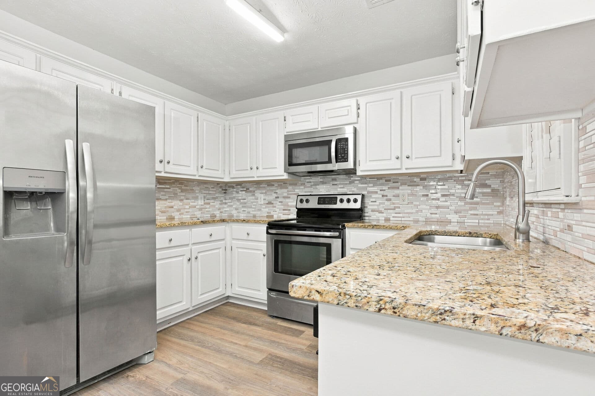 5 bedroom, 3.5 bathroom, 2,421 sq ft single family residence for sale at 1842 Plantation Creek Road, Fortson, GA 31808 — photo 2