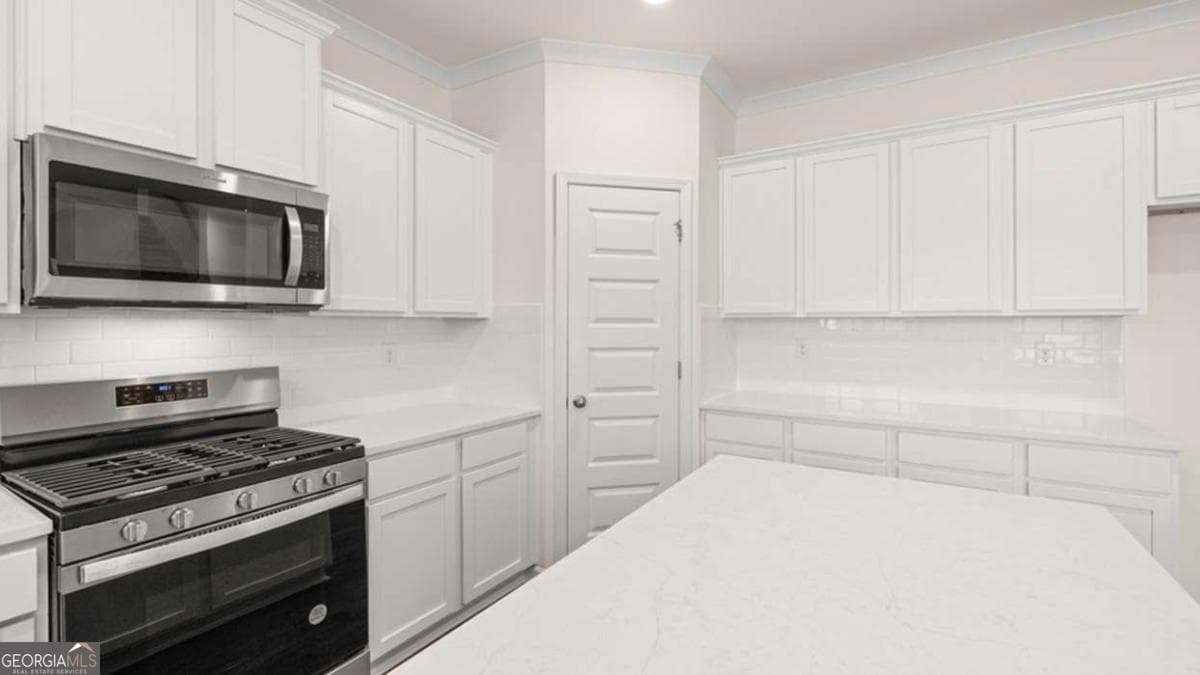 5 bedroom, 4 bathroom single family residence for sale at 3019 Champions Way, Loganville, GA 30052 — photo 6