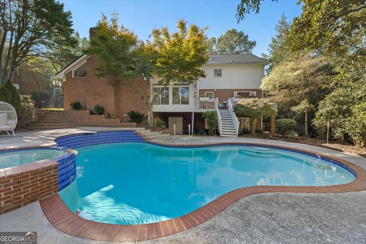 6 bedroom, 4.5 bathroom, 5,587 sq ft single family residence for sale at 235 Landfall Road, Sandy Springs, GA 30328 — photo 2