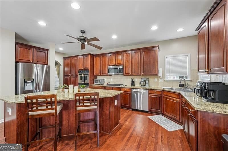 4 bedroom, 3 bathroom, 3,417 sq ft single family residence for sale at 3130 Bunting Run, Cumming, GA 30041 — photo 3