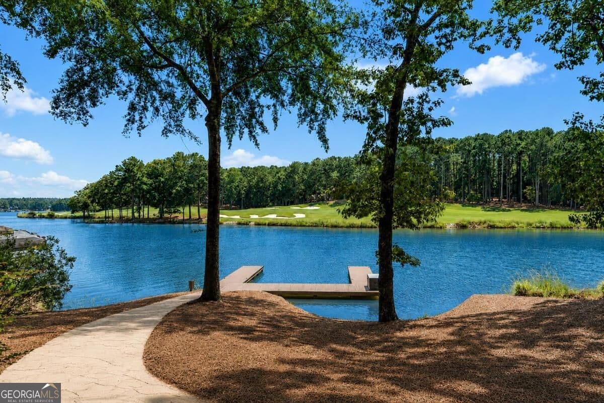 5 bedroom, 6.5 bathroom, 6,177 sq ft single family residence for sale at 1241 Lake Club Drive, Greensboro, GA 30642 — photo 2