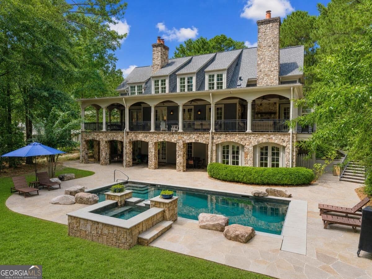 5 bedroom, 6.5 bathroom, 6,177 sq ft single family residence for sale at 1241 Lake Club Drive, Greensboro, GA 30642 — photo 1 of 53