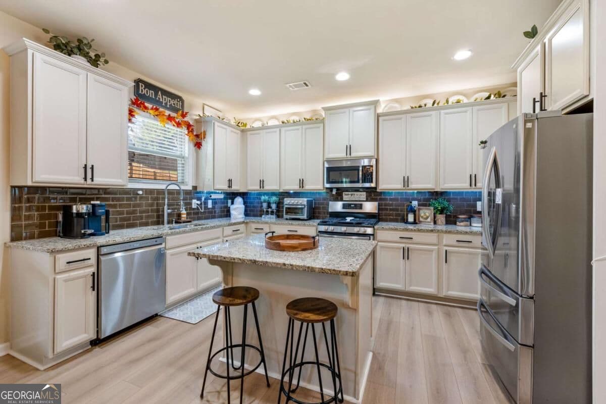 4 bedroom, 2.5 bathroom, 2,419 sq ft single family residence for sale at 4690 Settlers Grove Road, Cumming, GA 30028 — photo 6