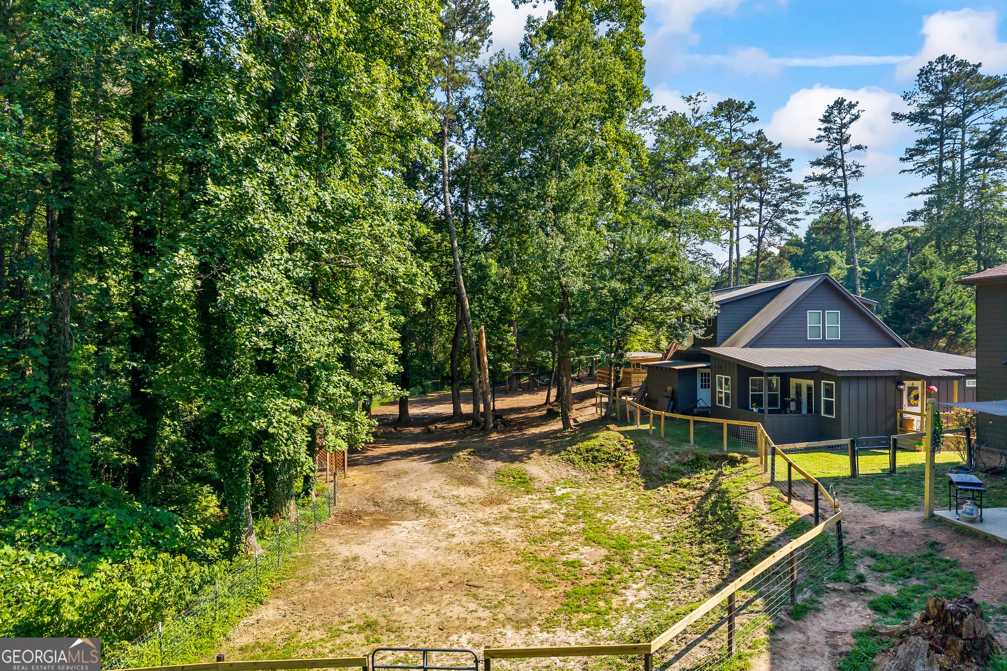 7 bedroom, 6.5 bathroom, 3,171 sq ft single family residence for sale at 9315 Meadowbrook Drive, Gainesville, GA 30506 — photo 4