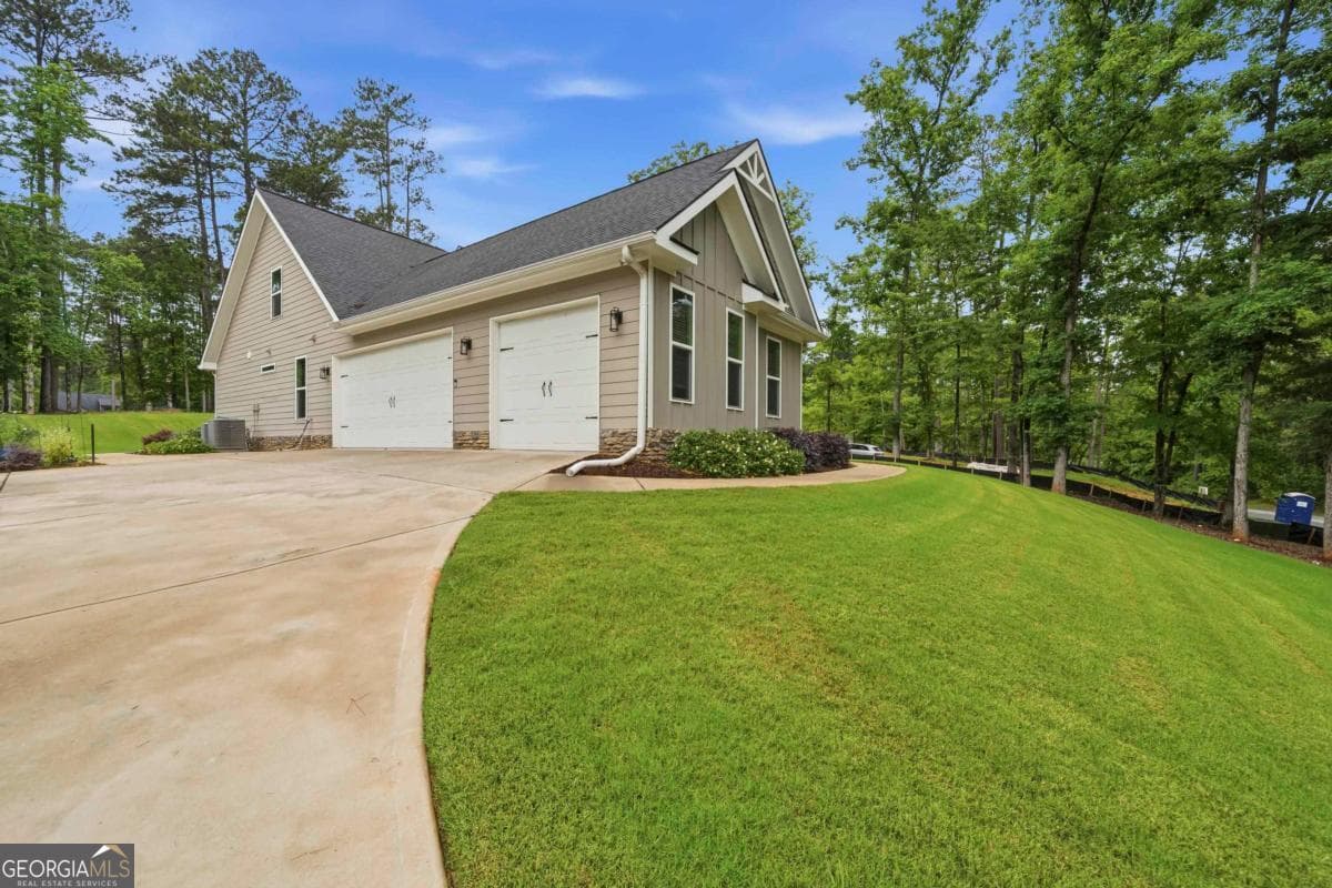 5 bedroom, 4 bathroom, 3,253 sq ft single family residence for sale at 1781 Osprey Poynte, Greensboro, GA 30642 — photo 4