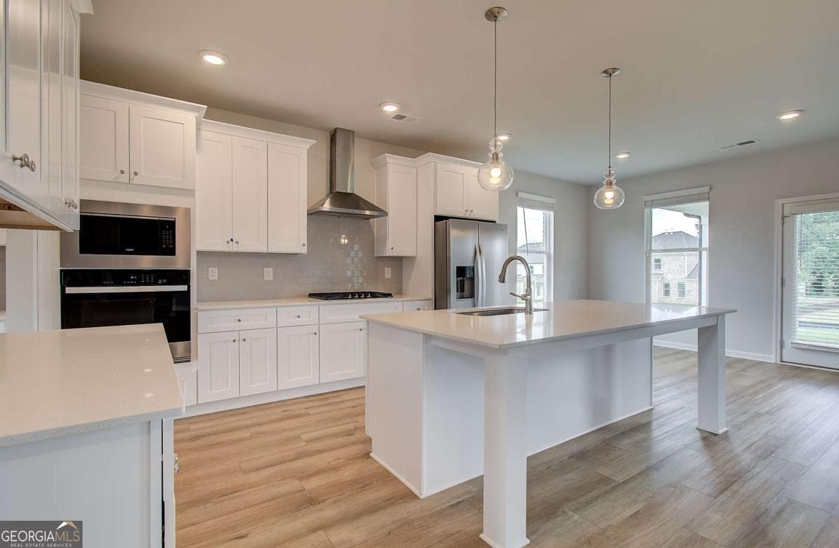 5 bedroom, 4.5 bathroom, 3,823 sq ft single family residence for sale at 708 Ripple End, Hampton, GA 30228 — photo 7
