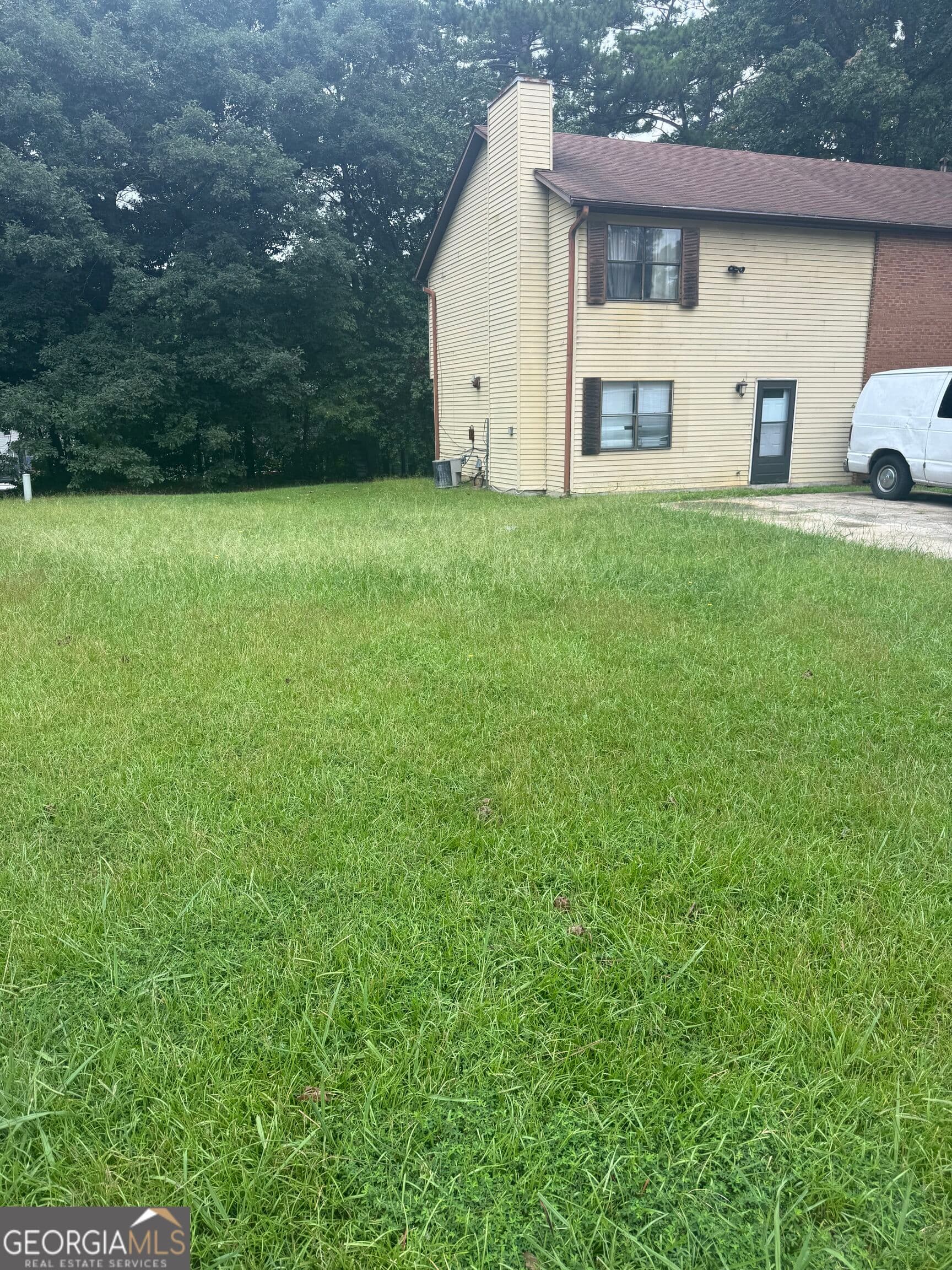 3 bedroom, 2.5 bathroom, 1,298 sq ft townhouse for sale at 5543 Windwood Road, Atlanta, GA 30349 — photo 3