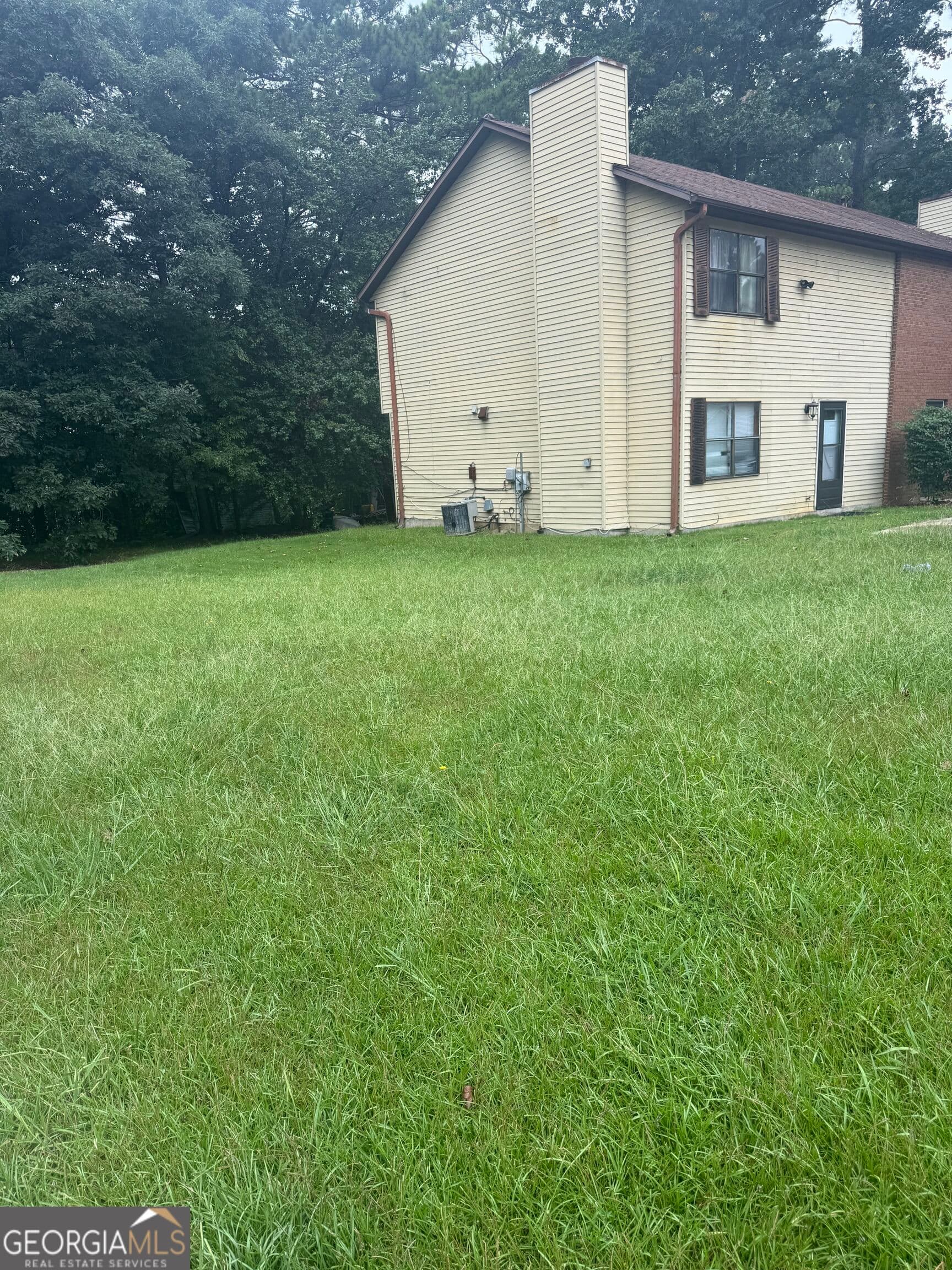 3 bedroom, 2.5 bathroom, 1,298 sq ft townhouse for sale at 5543 Windwood Road, Atlanta, GA 30349 — photo 4