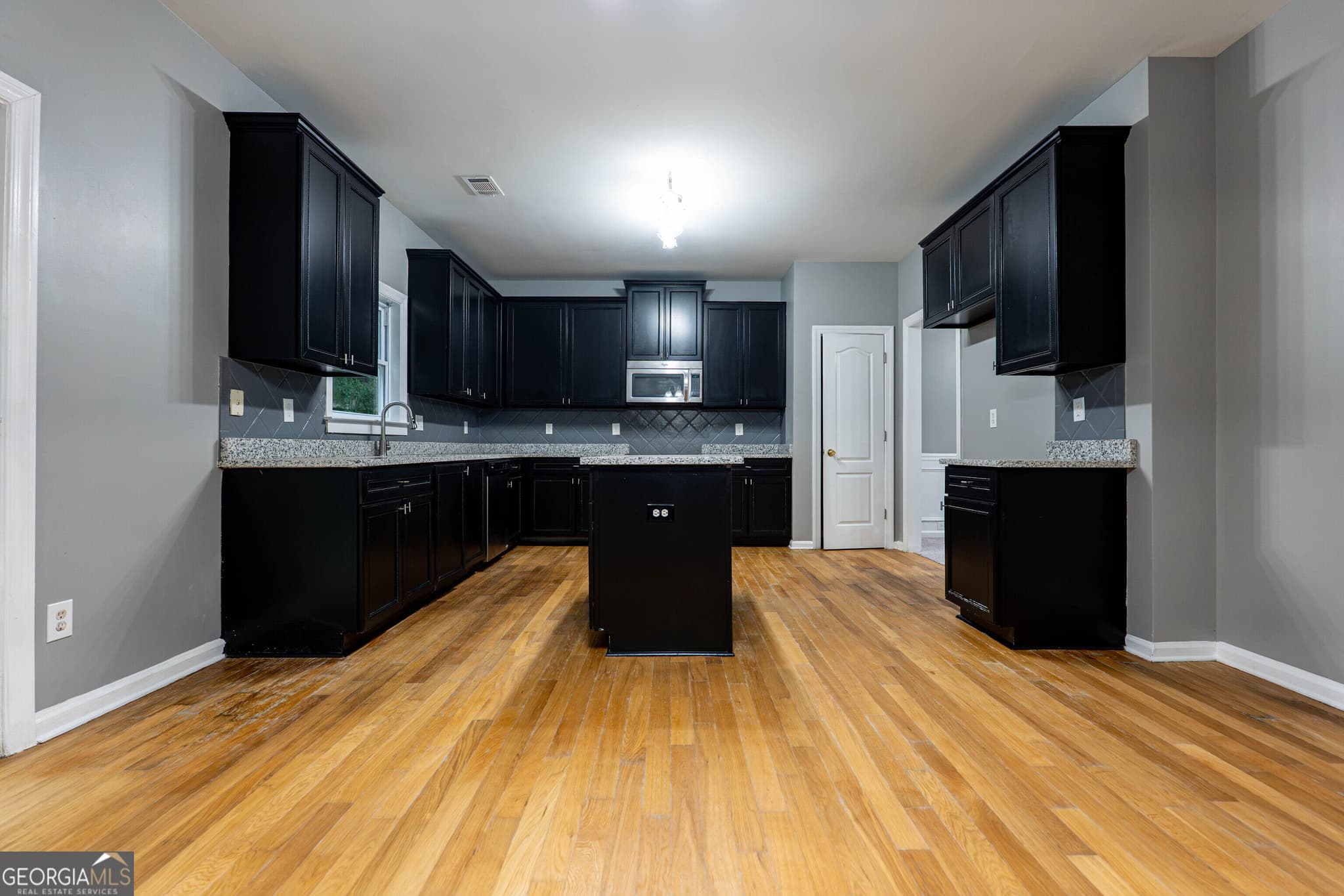 7 bedroom, 4 bathroom single family residence for sale at 1933 Temple Park Drive, Loganville, GA 30052 — photo 6