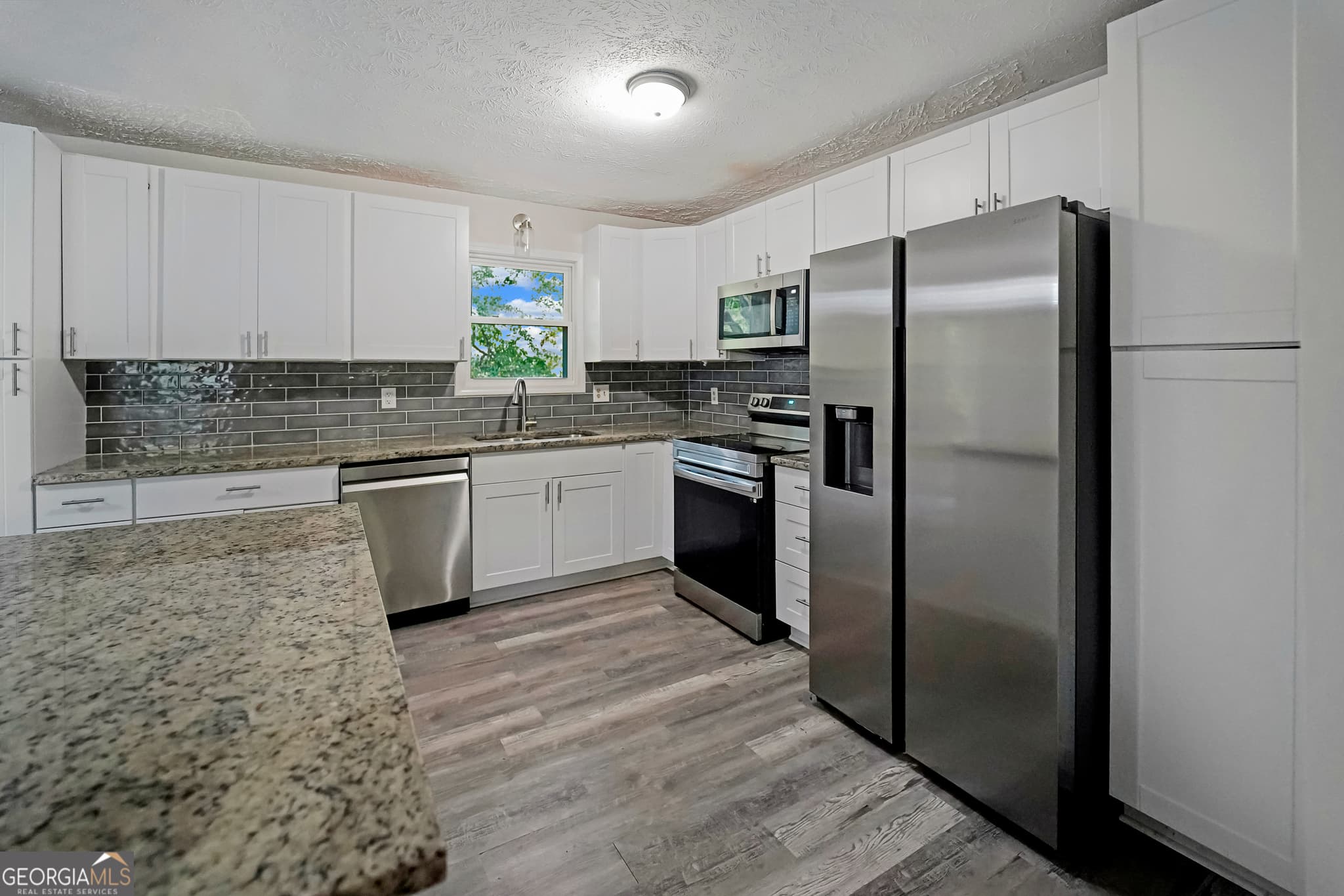 4 bedroom, 3 bathroom, 1,750 sq ft single family residence for sale at 3021 Lakeridge Drive, Conyers, GA 30094 — photo 9