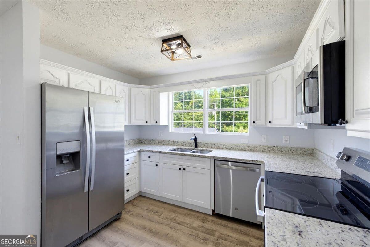 3 bedroom, 2 bathroom, 1,335 sq ft single family residence for sale at 910 Winterside Lane, Atlanta, GA 30349 — photo 8