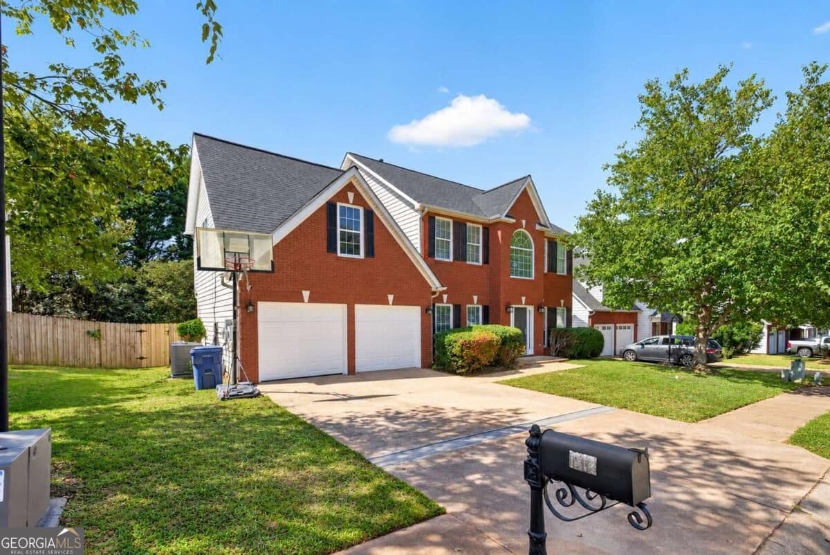 4 bedroom, 2.5 bathroom, 2,585 sq ft single family residence for sale at 1312 Woodland View Road, Lawrenceville, GA 30043 — photo 2
