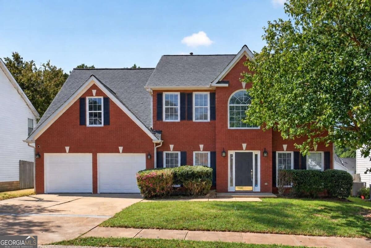 4 bedroom, 2.5 bathroom, 2,585 sq ft single family residence for sale at 1312 Woodland View Road, Lawrenceville, GA 30043 — photo 1 of 53