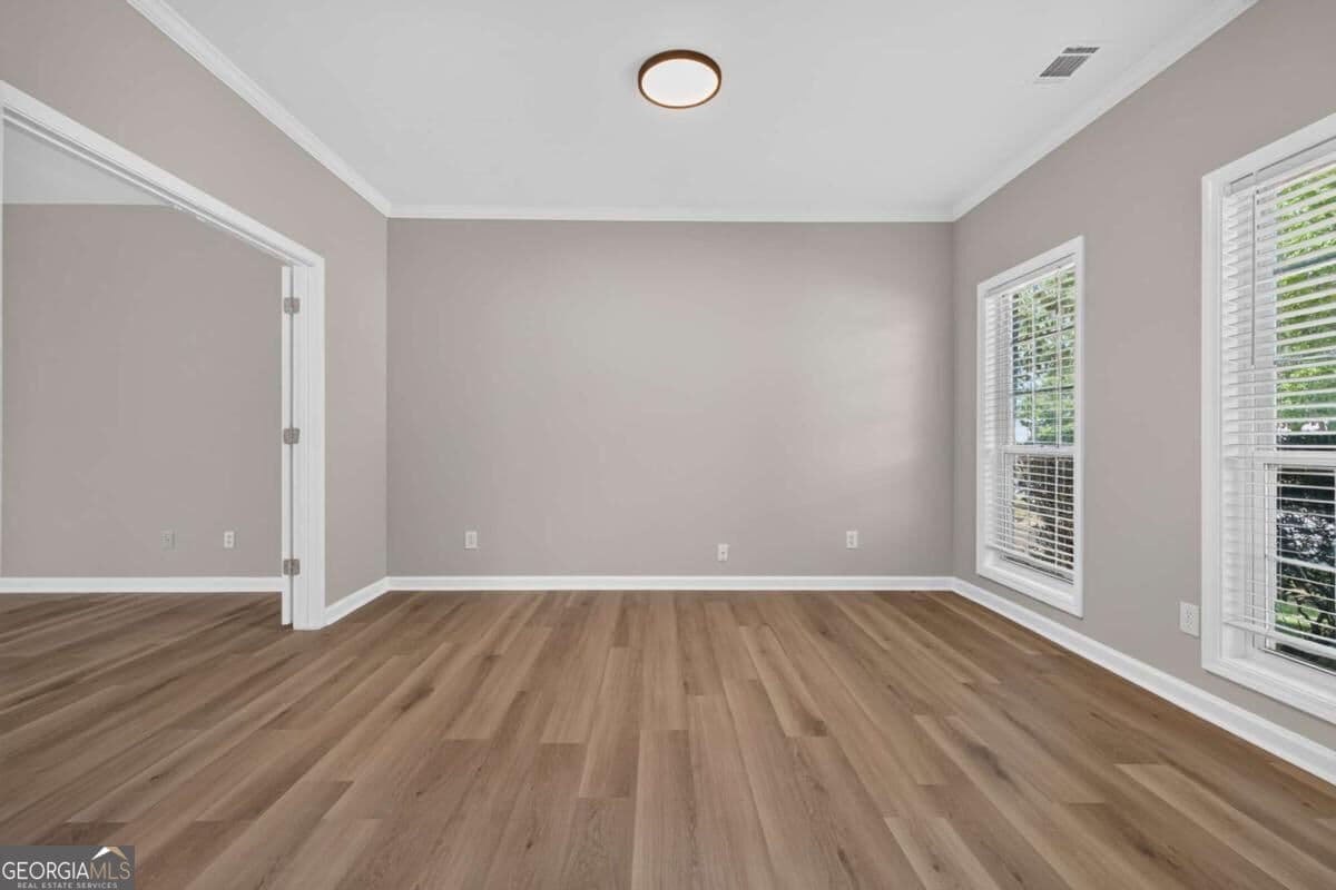 4 bedroom, 2.5 bathroom, 2,585 sq ft single family residence for sale at 1312 Woodland View Road, Lawrenceville, GA 30043 — photo 4