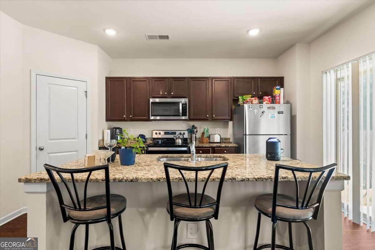3 bedroom, 2.5 bathroom, 2,460 sq ft single family residence for sale at 7627 Rudder Circle, South Fulton, GA 30213 — photo 10