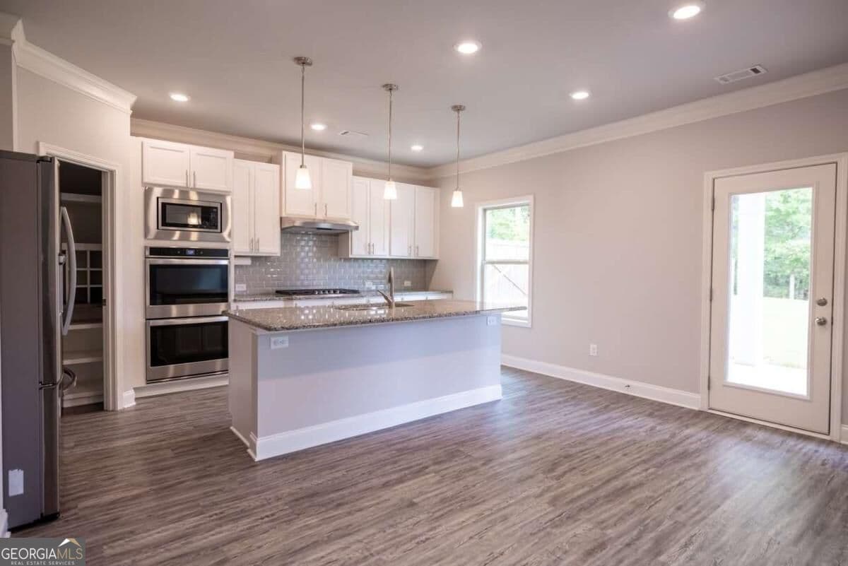 5 bedroom, 4 bathroom, 3,385 sq ft single family residence for sale at 352 Newshaw Drive, Lawrenceville, GA 30046 — photo 6