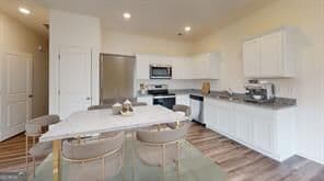 3 bedroom, 2.5 bathroom, 1,421 sq ft townhouse for sale at 1147 Lucienne Boulevard, Auburn, GA 30011 — photo 6