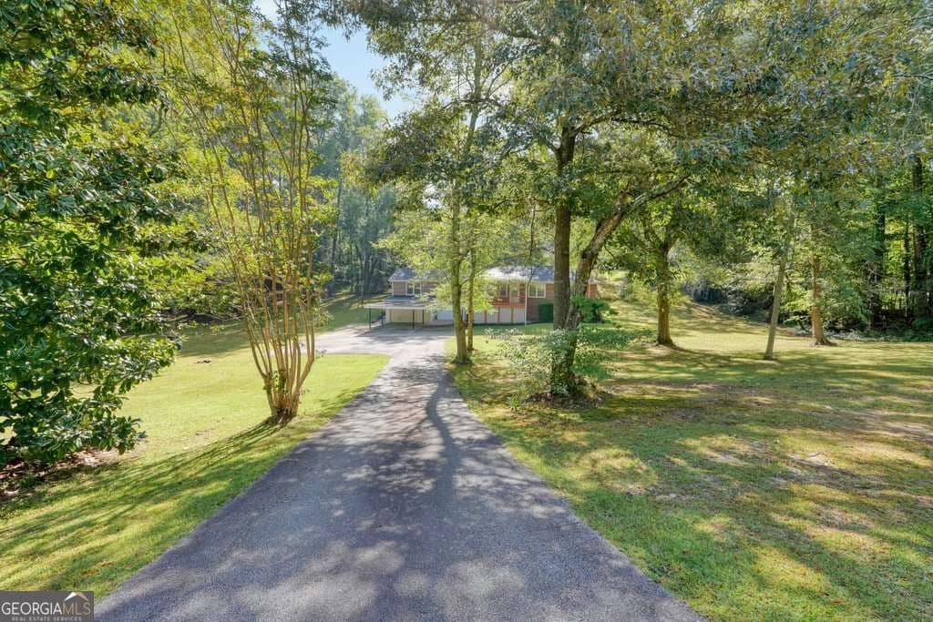 4 bedroom, 2 bathroom, 1,685 sq ft single family residence for sale at 7146 Old Beulah Road, Lithia Springs, GA 30122 — photo 2