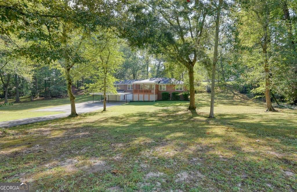 4 bedroom, 2 bathroom, 1,685 sq ft single family residence for sale at 7146 Old Beulah Road, Lithia Springs, GA 30122 — photo 4