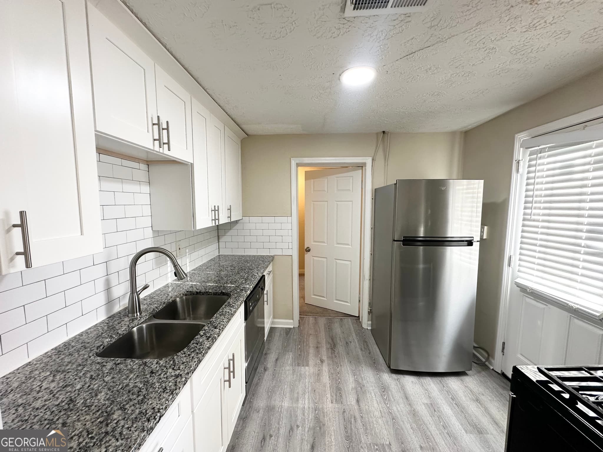 4 bedroom, 1 bathroom, 1,409 sq ft single family residence for sale at 1876 Flat Shoals Road, Atlanta, GA 30316 — photo 5