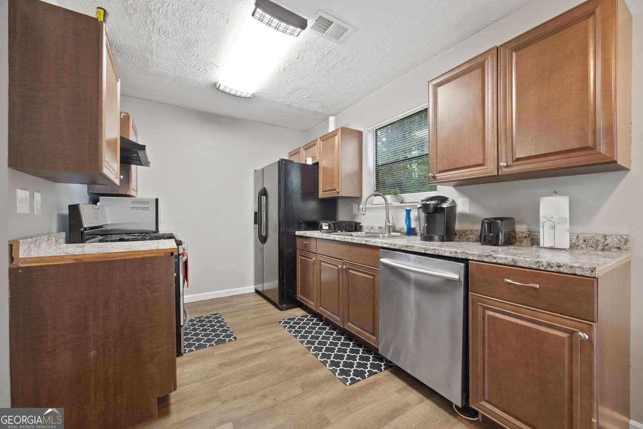 3 bedroom, 2 bathroom, 1,456 sq ft single family residence for sale at 4064 PANOLA WOODS Drive, Stonecrest, GA 30038 — photo 10