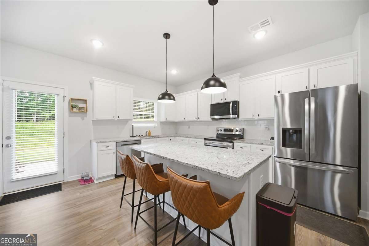 4 bedroom, 2.5 bathroom, 2,458 sq ft single family residence for sale at 1000 Northfield Drive, Conyers, GA 30013 — photo 10
