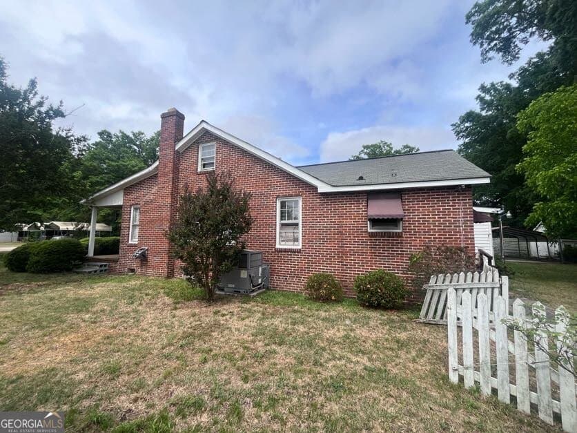 4 bedroom, 2.5 bathroom, 2,057 sq ft single family residence for sale at 211 Gordon Street, Thomson, GA 30824 — photo 2