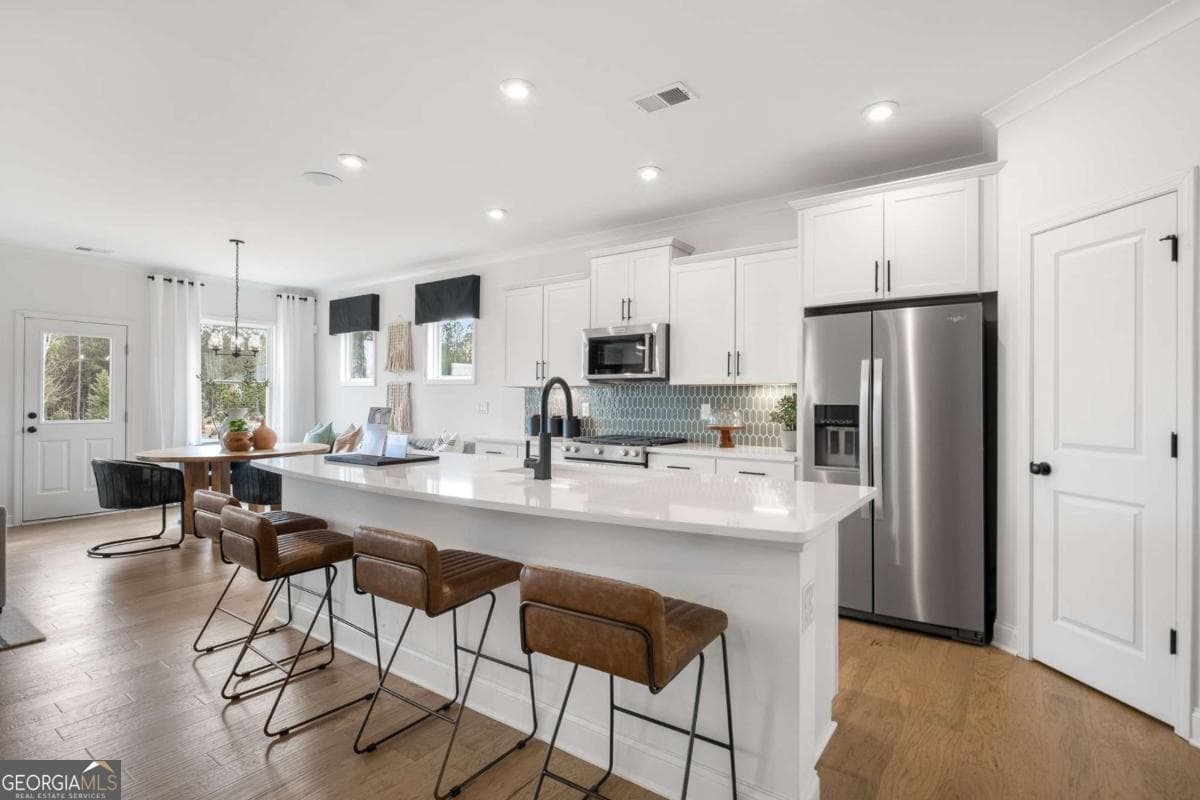 5 bedroom, 3 bathroom, 2,956 sq ft single family residence for sale at 6090 Marigold Way, Atlanta, GA 30349 — photo 8