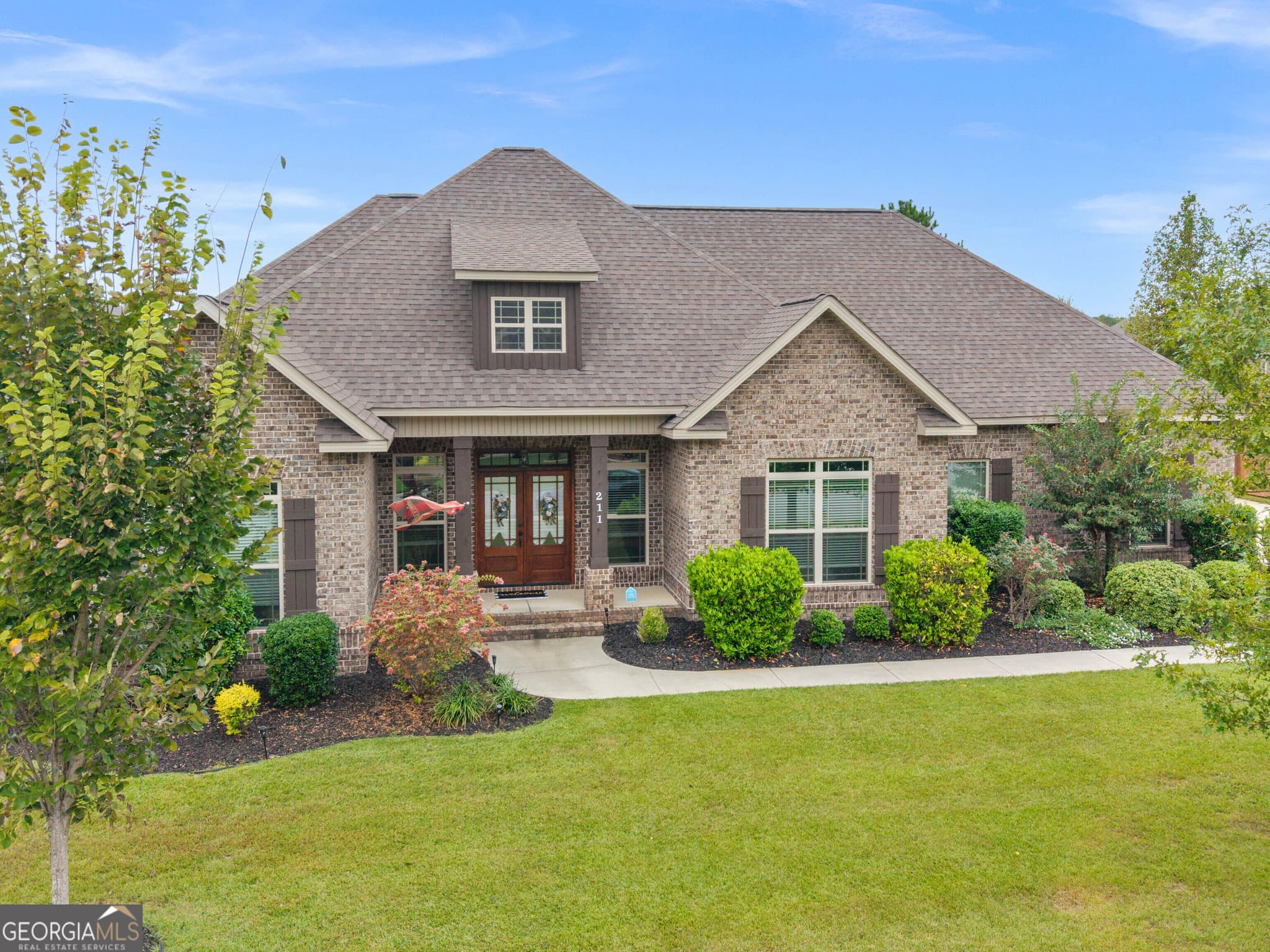 4 bedroom, 3 bathroom, 2,431 sq ft single family residence for sale at 211 Woodlands Boulevard, Kathleen, GA 31047 — photo 2