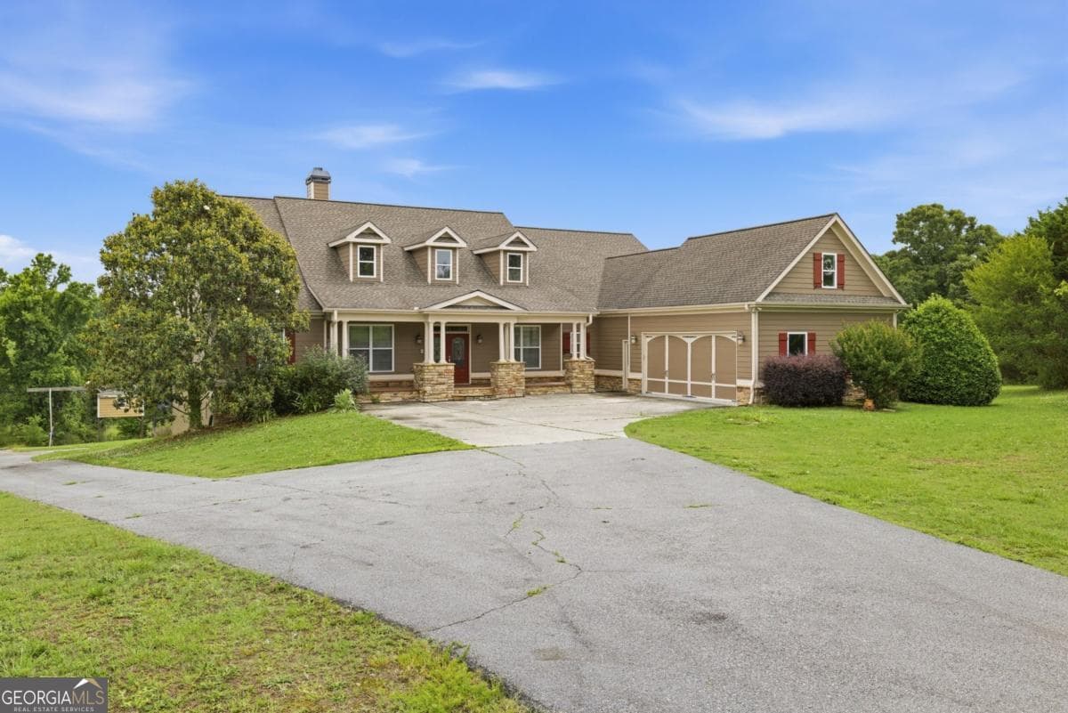 5 bedroom, 3.5 bathroom, 3,996 sq ft single family residence for sale at 1173 Dee Kennedy Road, Auburn, GA 30011 — photo 2