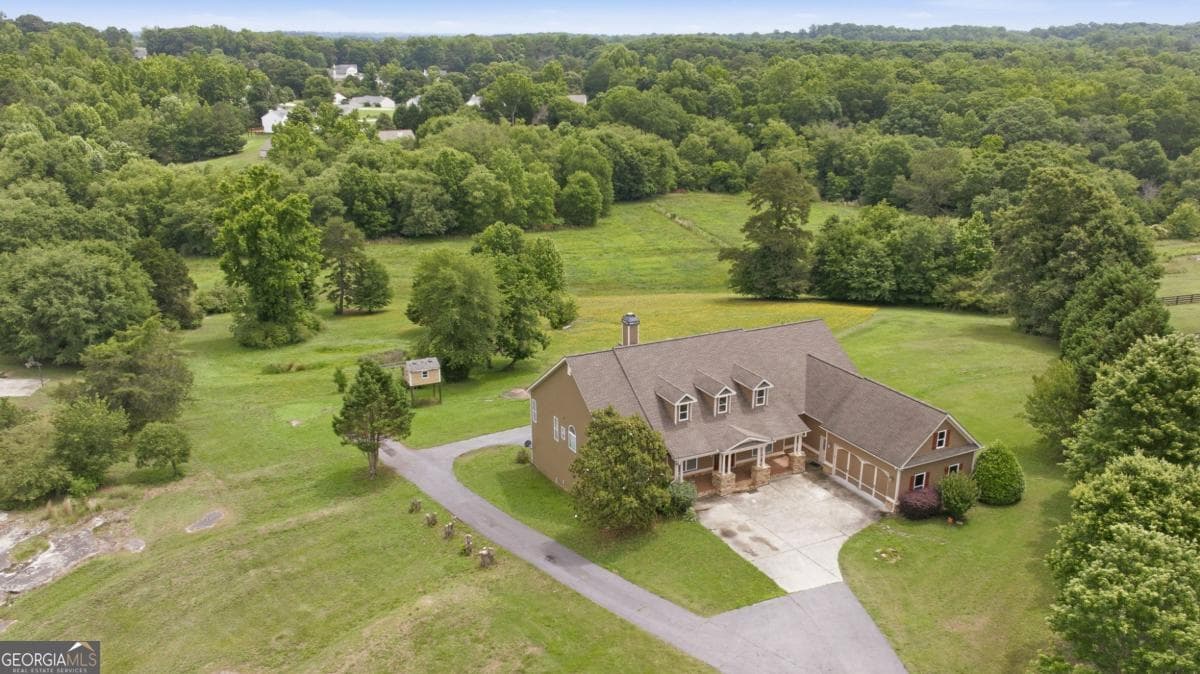 5 bedroom, 3.5 bathroom, 3,996 sq ft single family residence for sale at 1173 Dee Kennedy Road, Auburn, GA 30011 — photo 1 of 84