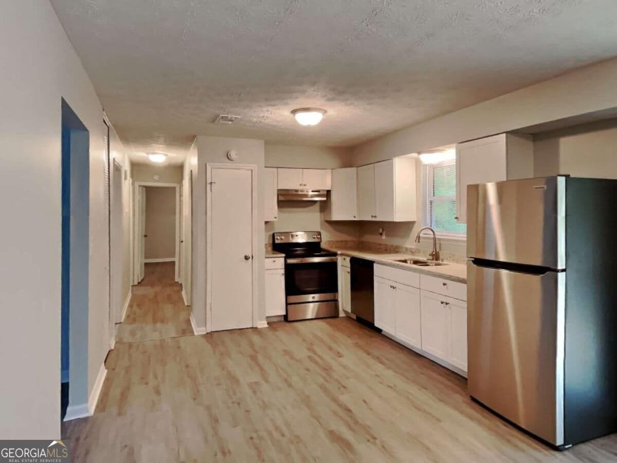 3 bedroom, 1.5 bathroom single family residence for rent at 2938 Woodfield Drive, Rex, GA 30273 for $1,735 a month — photo 2