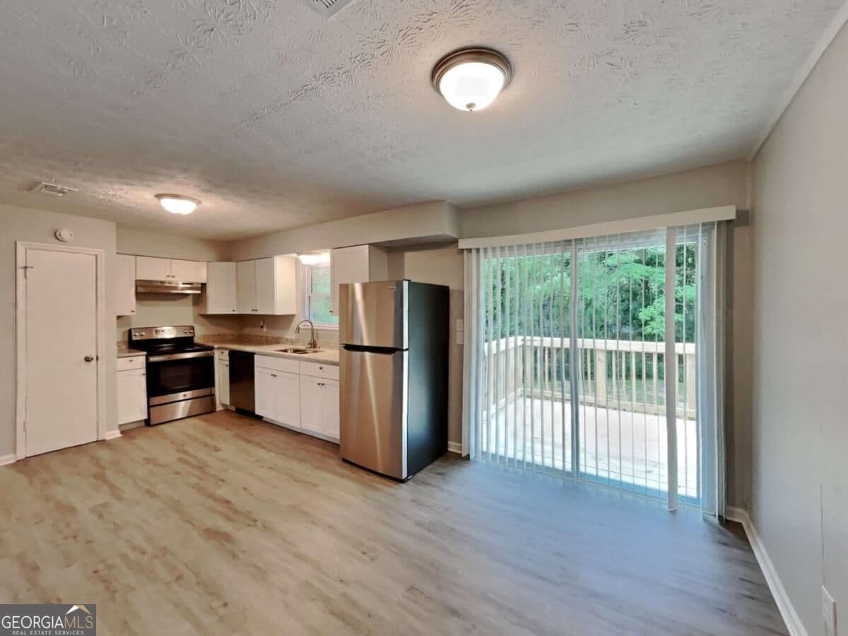 3 bedroom, 1.5 bathroom single family residence for rent at 2938 Woodfield Drive, Rex, GA 30273 for $1,735 a month — photo 3