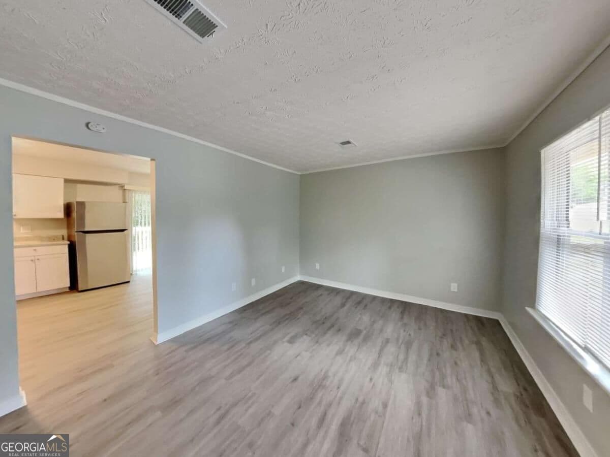 3 bedroom, 1.5 bathroom single family residence for rent at 2938 Woodfield Drive, Rex, GA 30273 for $1,735 a month — photo 4