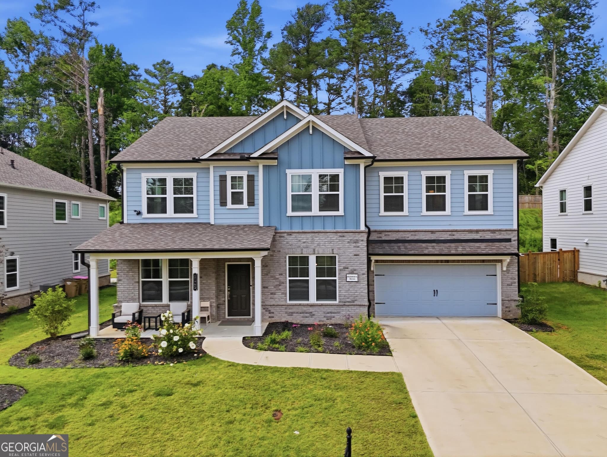 5 bedroom, 4.5 bathroom, 3,190 sq ft single family residence for sale at 5145 Lansdale Court, Cumming, GA 30028 — photo 1 of 58