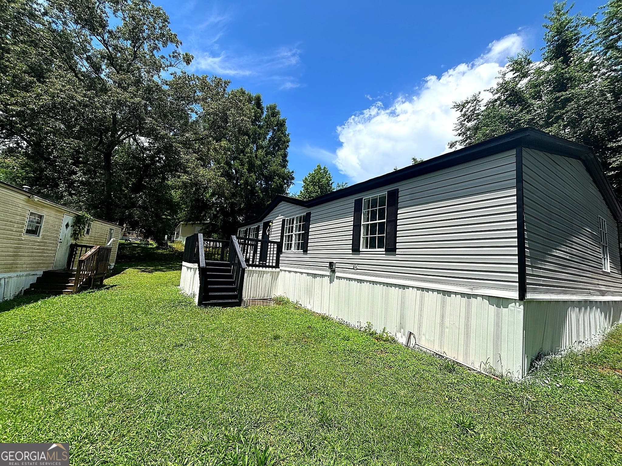 3 bedroom, 2 bathroom, 1,650 sq ft manufactured home,single family residence for sale at 225 Stratford Drive, Hampton, GA 30228 — photo 2