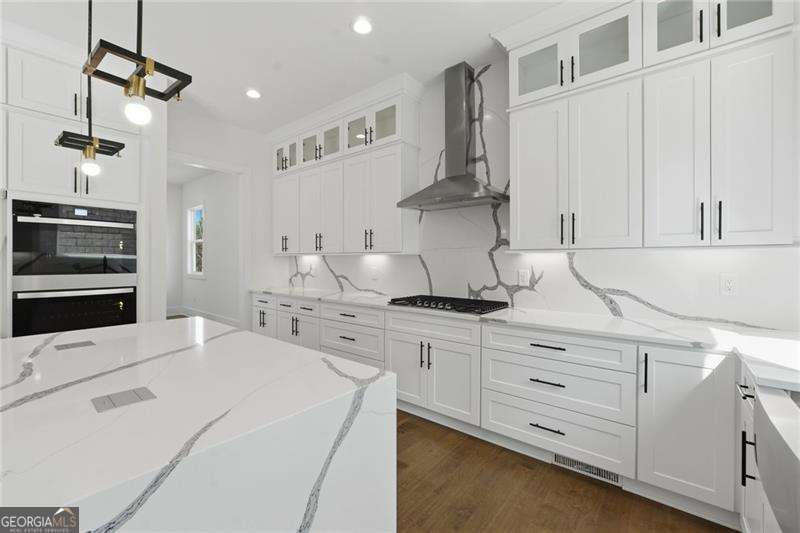 5 bedroom, 4 bathroom, 3,687 sq ft single family residence for sale at 3985 Clifton Hill Court, Cumming, GA 30040 — photo 3