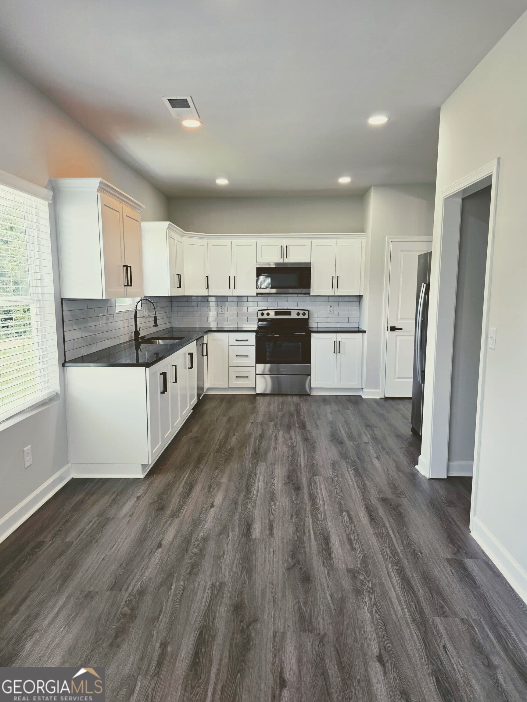 4 bedroom, 2.5 bathroom, 2,169 sq ft single family residence for sale at 448 N Hill Street, Griffin, GA 30223 — photo 10