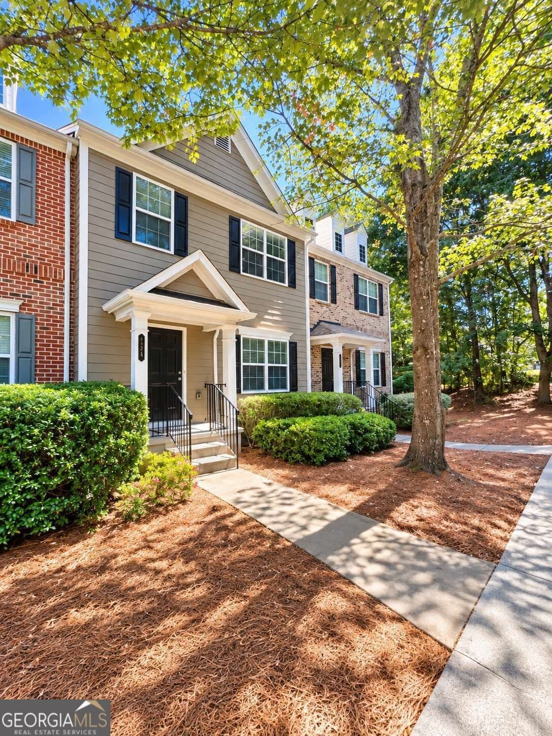 4 bedroom, 2.5 bathroom, 1,870 sq ft townhouse for sale at 724 Breeze Lane, Woodstock, GA 30188