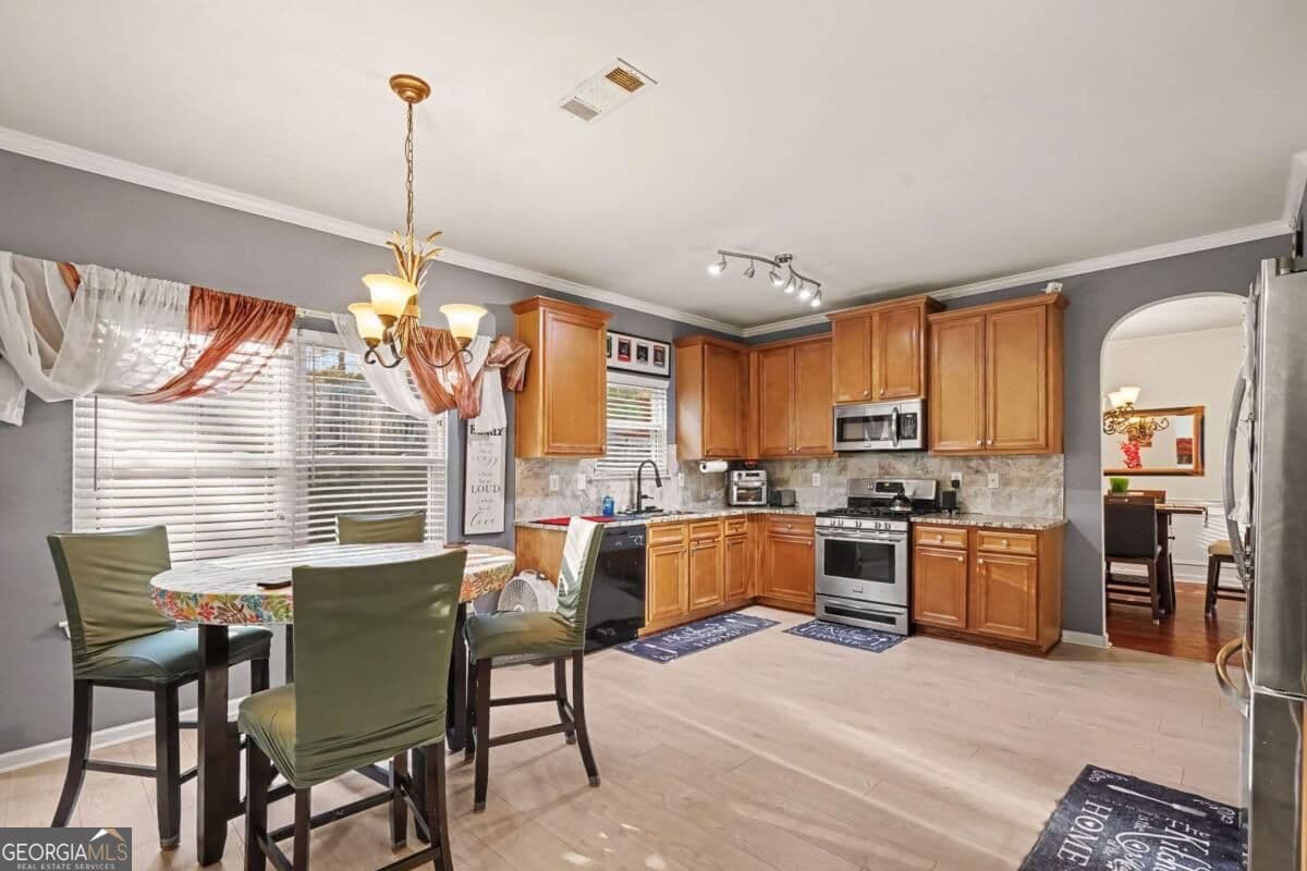 6 bedroom, 4 bathroom, 3,656 sq ft single family residence for sale at 3609 River Rock Road, Lithonia, GA 30038 — photo 10
