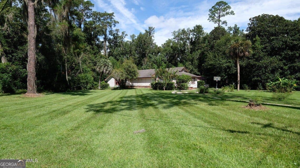 4 bedroom, 3 bathroom, 2,202 sq ft single family residence for sale at 402 W 3Rd Street, Woodbine, GA 31569 — photo 2
