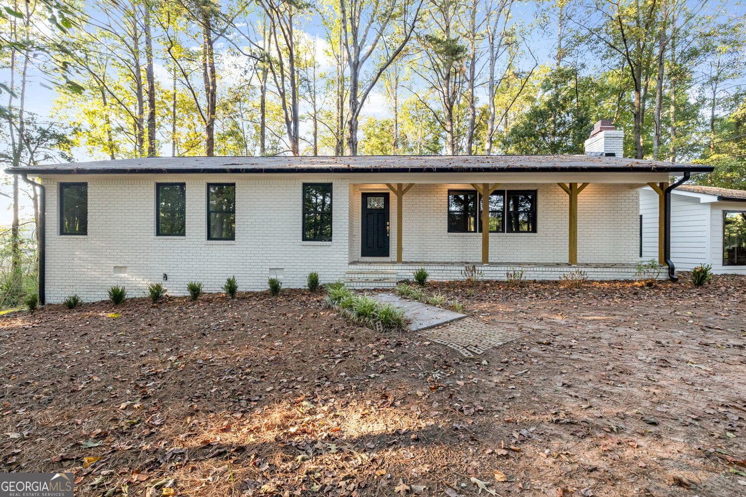 2 bedroom, 1.5 bathroom, 1,484 sq ft single family residence for sale at 6309 Putnam Ford Drive, Woodstock, GA 30189 — photo 1 of 29
