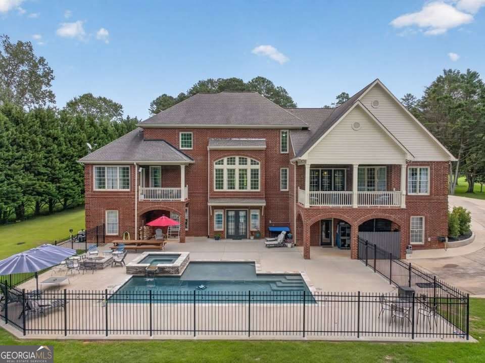 7 bedroom, 6.5 bathroom, 9,752 sq ft single family residence under contract at 4728 E Reed Road, Gainesville, GA 30507 — photo 2